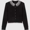Cardigan with removable beaded collar Cardigan with removable beaded collar