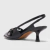 Leather pumps with eyelet strap Leather pumps with eyelet strap