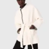 Lined coat with contrasting ribbon Lined coat with contrasting ribbon