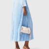 Long pleated dress with eyelets Long pleated dress with eyelets