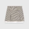 Pleated skirt with poplin details Pleated skirt with poplin details