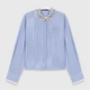 Shirt with removable jewel collar Shirt with removable jewel collar
