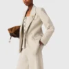 Suit jacket with brooch