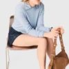 Sweater with jeweled bows on back Sweater with jeweled bows on back